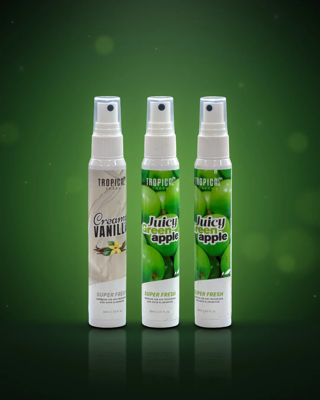 Creamy Vanilla en twee Juicy Green Apple sprays van 60 ml naast elkaar, echte productfoto