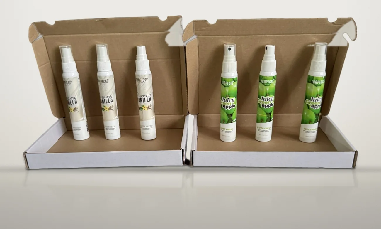 Echte foto van de verzenddoosjes met Creamy Vanilla en Juicy Green Apple sprays